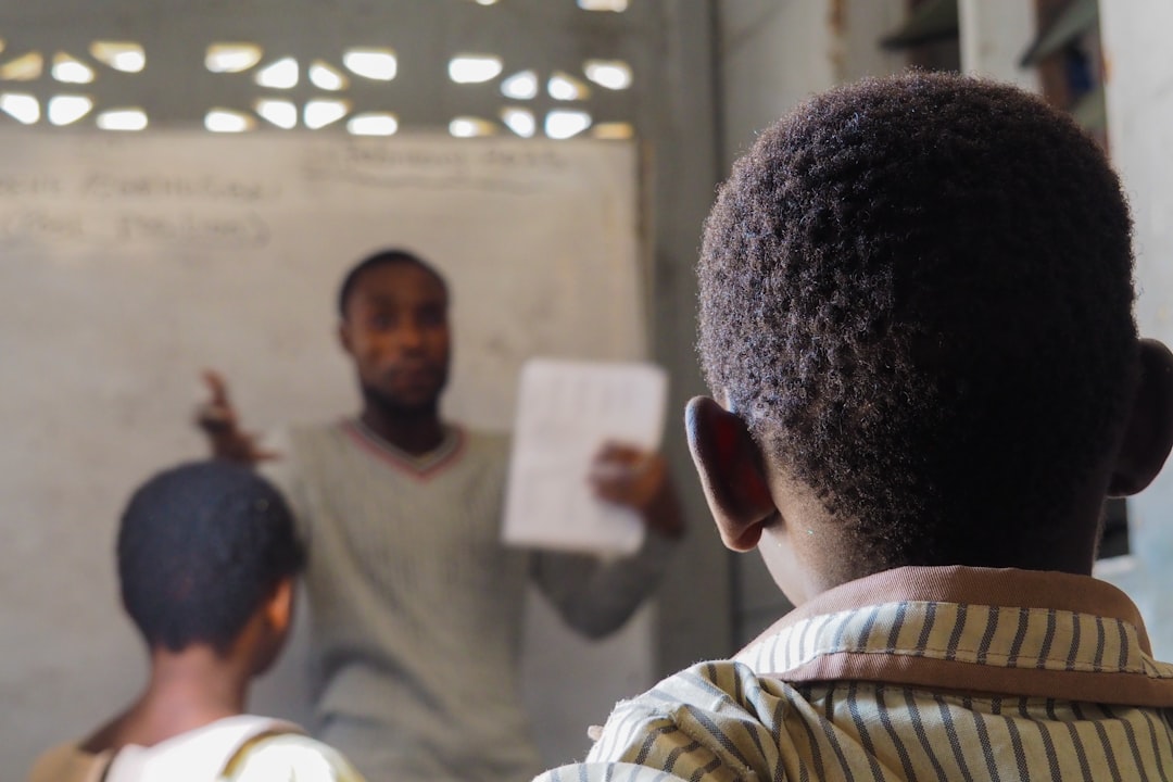 Home Teacher instructing students in a classroom for digital skills training